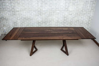 blackened walnut end extension table on walnut chevron legs