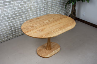 Jarvis Oval Pedestal Table in Natural Ash