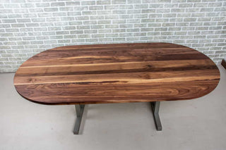 oval walnut table on nickel colored steel legs