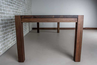 blackened walnut parson table on estling base