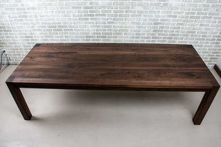 blackened walnut parson table on estling base