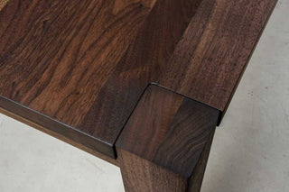 blackened walnut parson table on estling base