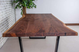 live edge walnut table on black steel angle legs