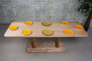 long wood dining table in maple on double pedestal base