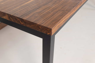 walnut dining table on steel parsons base