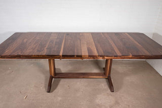 Geared extendable walnut table on pedestal  base