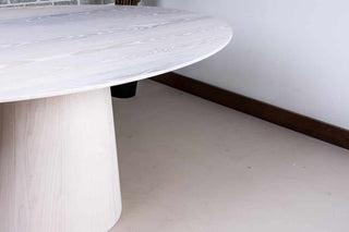 White Oval Table on Wood Cylinder Base