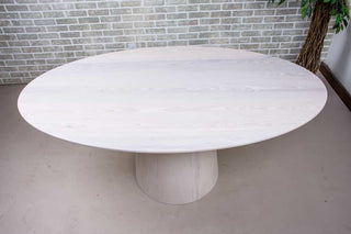 White Oval Table on Wood Cylinder Base