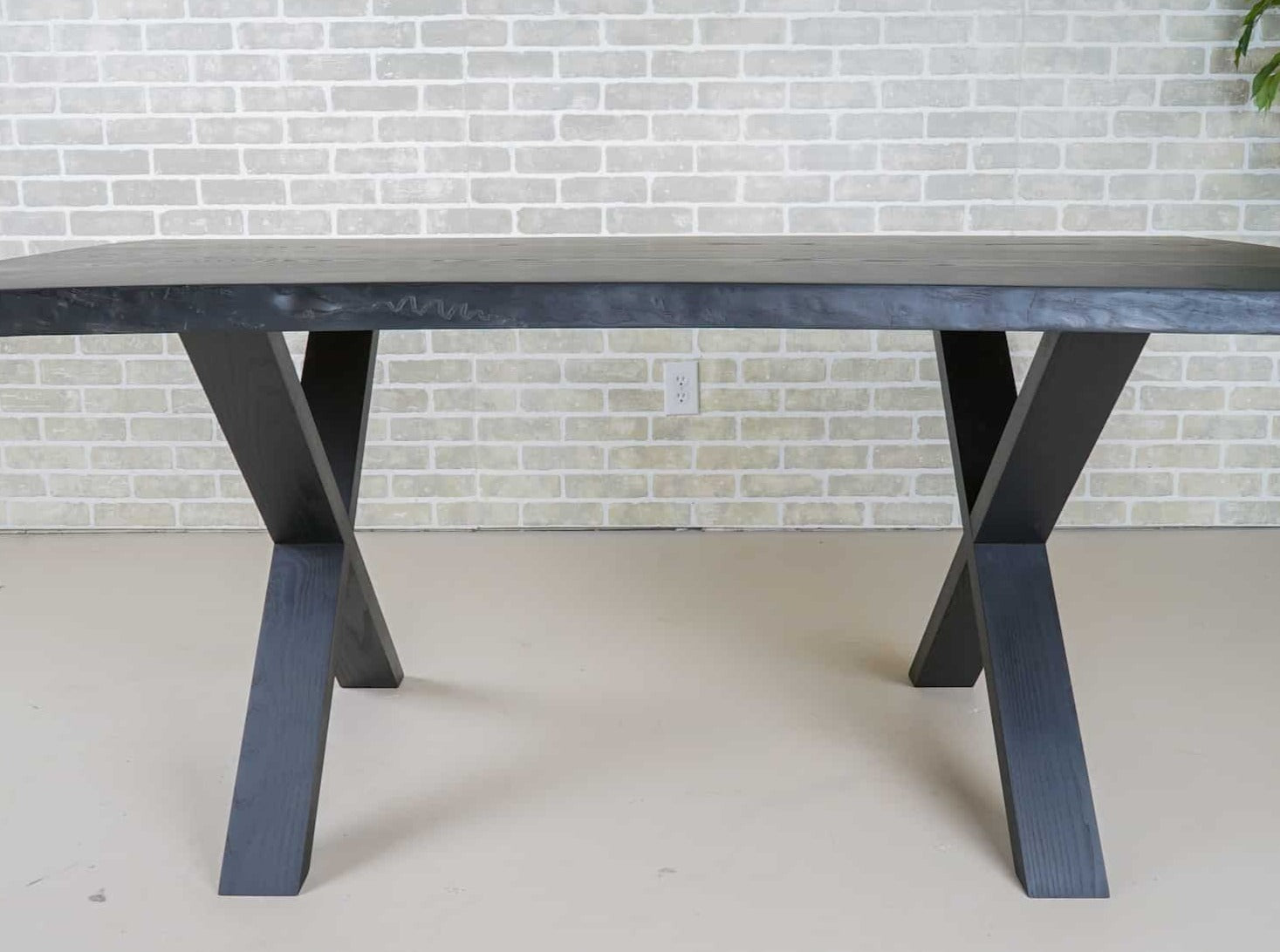 live edge ash bookmatch table on wood legs finished in black