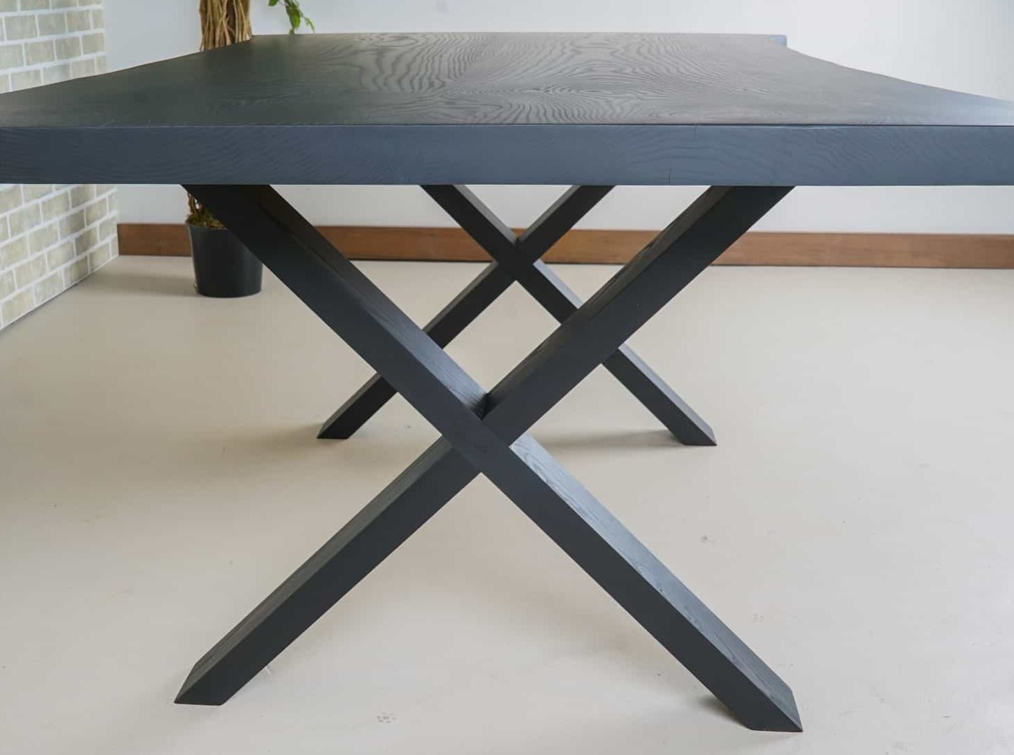 live edge ash bookmatch table on wood legs finished in black