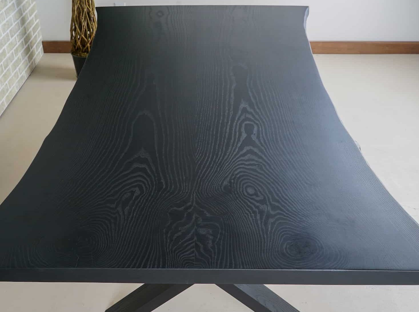 live edge ash bookmatch table on wood legs finished in black