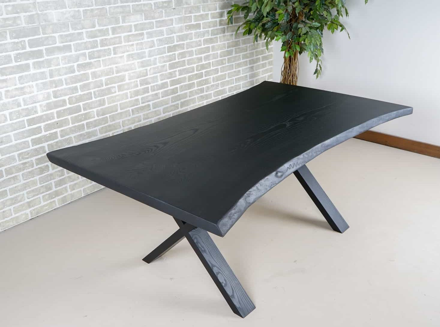 live edge ash bookmatch table on wood legs finished in black