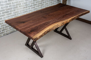Live edge walnut table on burnt penny steel legs.