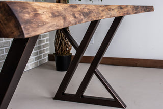 Live edge walnut table on burnt penny steel legs.
