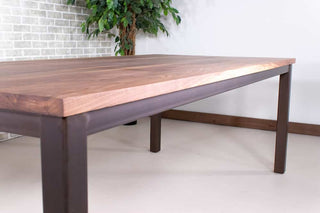 walnut dining table on burnt penny steel parsons base