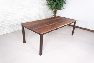 walnut dining table on burnt penny steel parsons base
