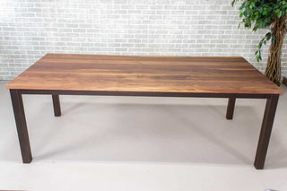 walnut dining table on burnt penny steel parsons base