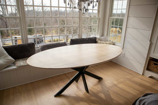 oval table on steel starburst base