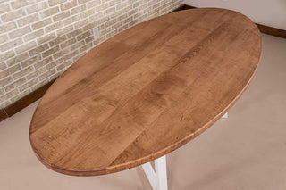 oval maple table in coconut on white steel legs