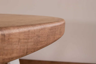 oval maple table in coconut on white steel legs