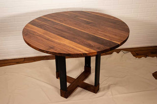 round walnut table on hybrid pedestal base