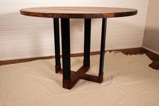 round walnut table on hybrid pedestal base