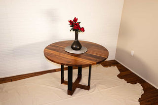 round walnut table on hybrid pedestal base