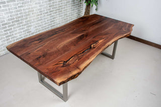 live edge walnut table on square steel legs finished in nickel