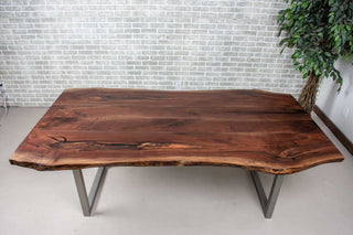 live edge walnut table on square steel legs finished in nickel