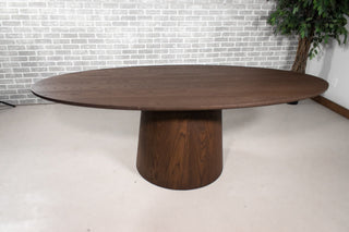 Elliptical oval oak table on a cone base in espresso