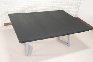 black extending table on silver steel legs