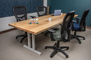 Rock maple table on white steel legs.