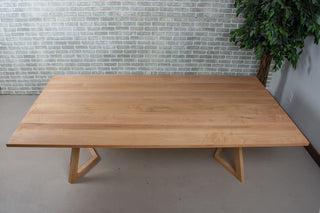 Rectangular maple wood dining table.