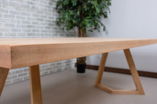 Rectangular maple wood dining table.