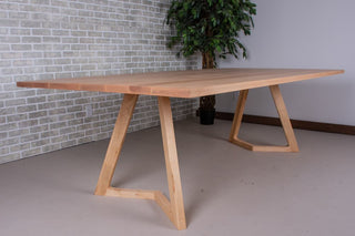 Rectangular maple wood dining table.