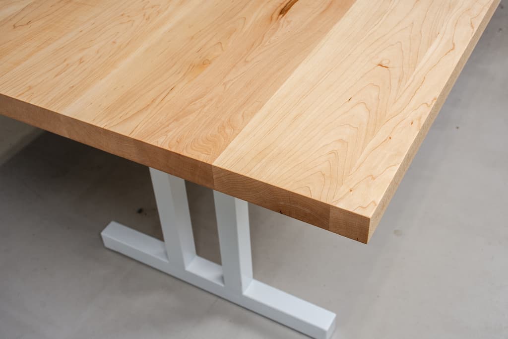 large scandinavian maple table on white legs