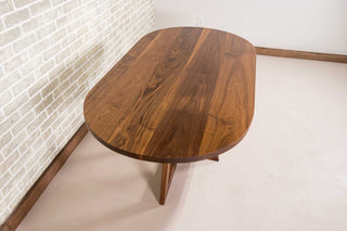 walnut racetrack oval dining table on pedestal base