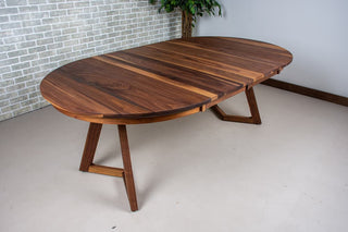 walnut round extendable table on wood legs