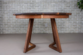 walnut round extendable table on wood legs