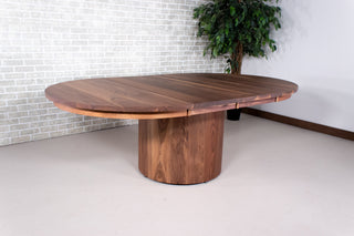 extendable round table on walnut cylinder base