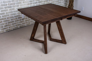 Dark wood extendable dinner table.