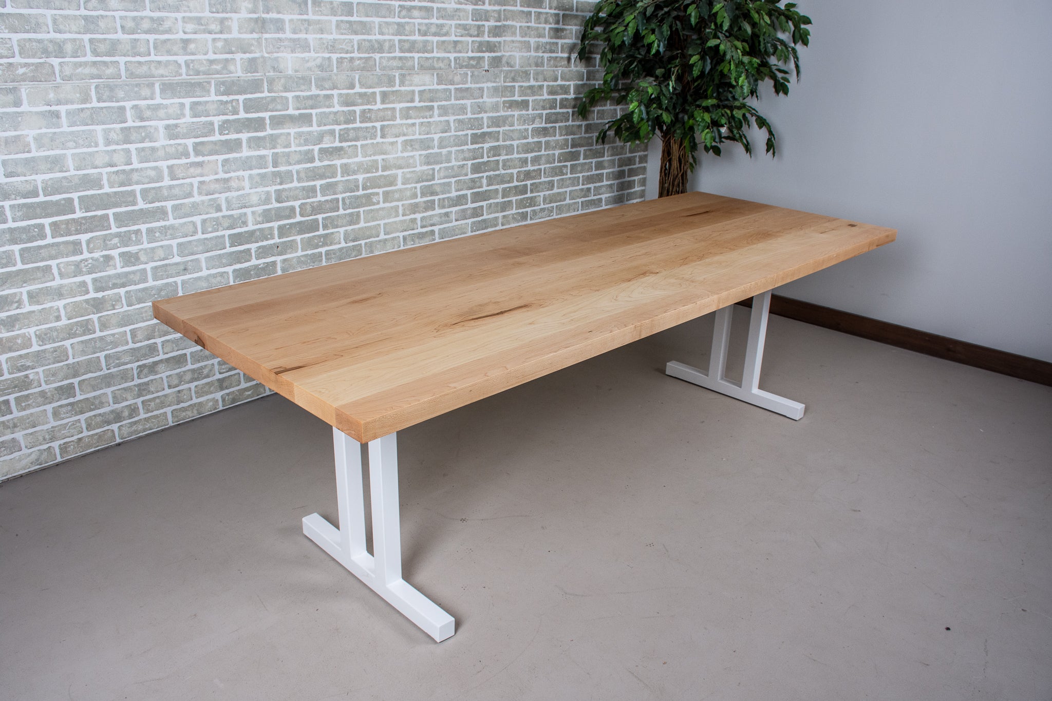 large scandinavian maple table on white legs