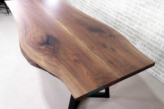 live edge walnut bookmatch table on black steel chevron legs