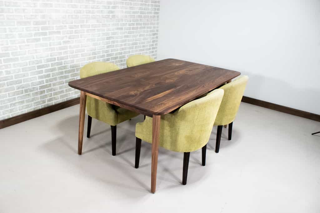 midcentury parsons table in walnut on skinny legs