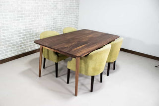 midcentury parsons table in walnut on skinny legs