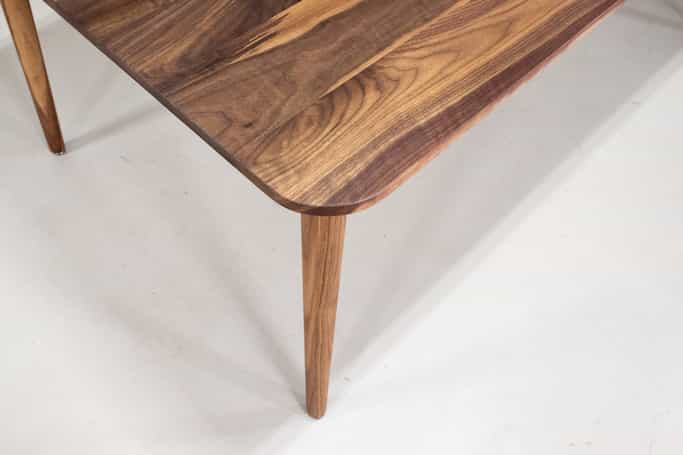 midcentury parsons table in walnut on skinny legs