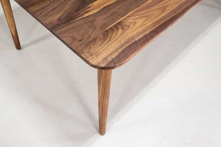 midcentury parsons table in walnut on skinny legs