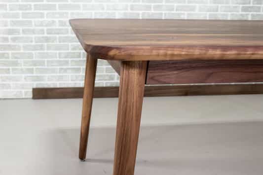 midcentury parsons table in walnut on skinny legs