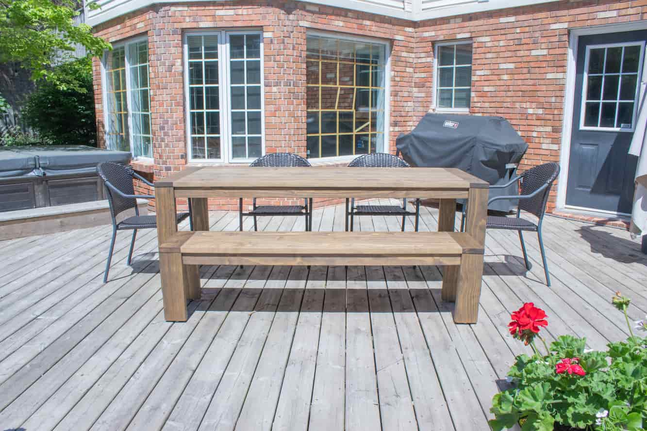 outdoor wood table and bench on a patio