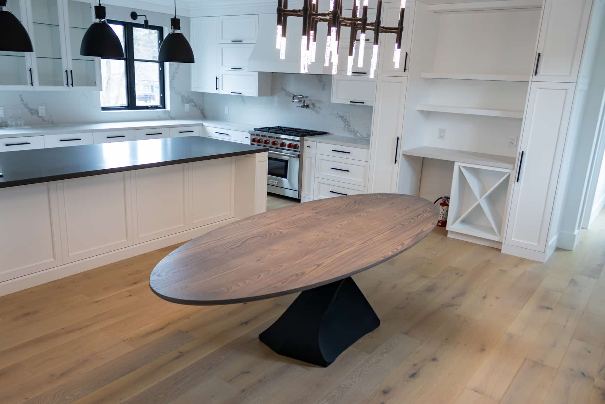 large oval table on tulipe base